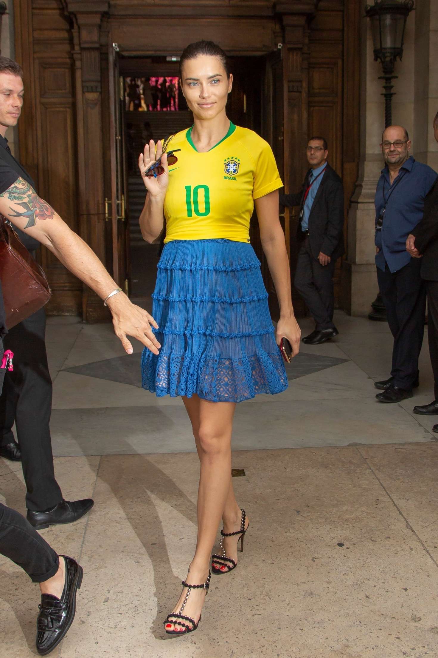 Adriana Lima in a patriotic Brazil football shirt out in Paris