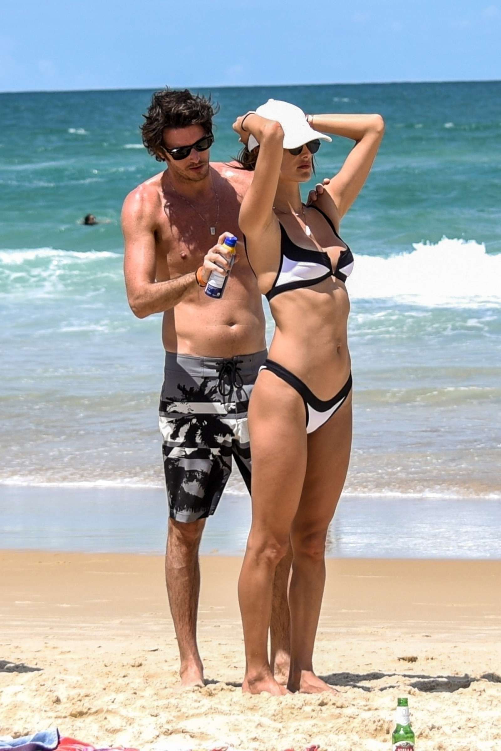 Alessandra Ambrosio in White and Black Bikini on the beach in Florianopolis