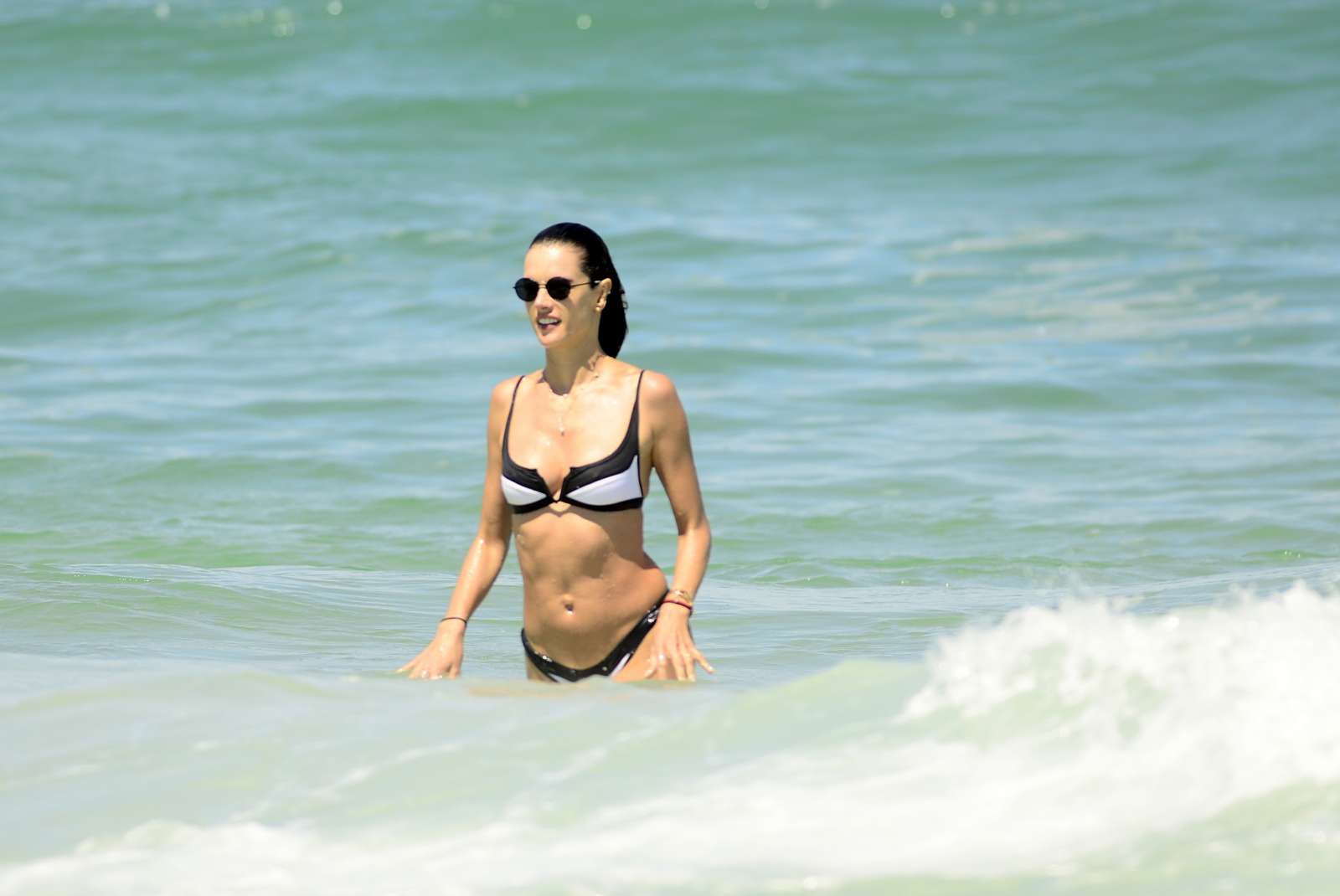 Alessandra Ambrosio in White and Black Bikini on the beach in Florianopolis