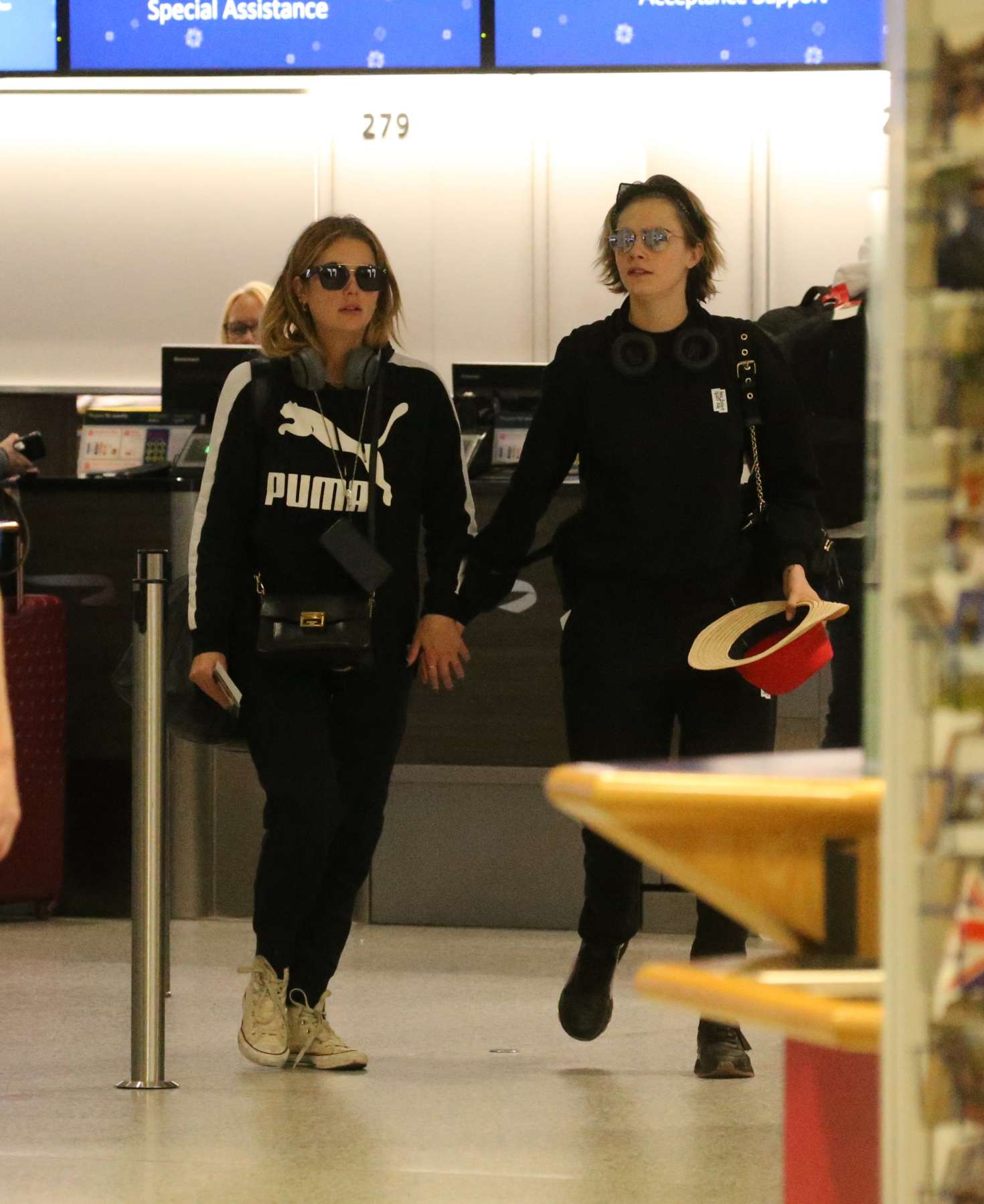 Ashley Benson and Cara Delevingne â€“ Arrives at Gatwick Airport in England