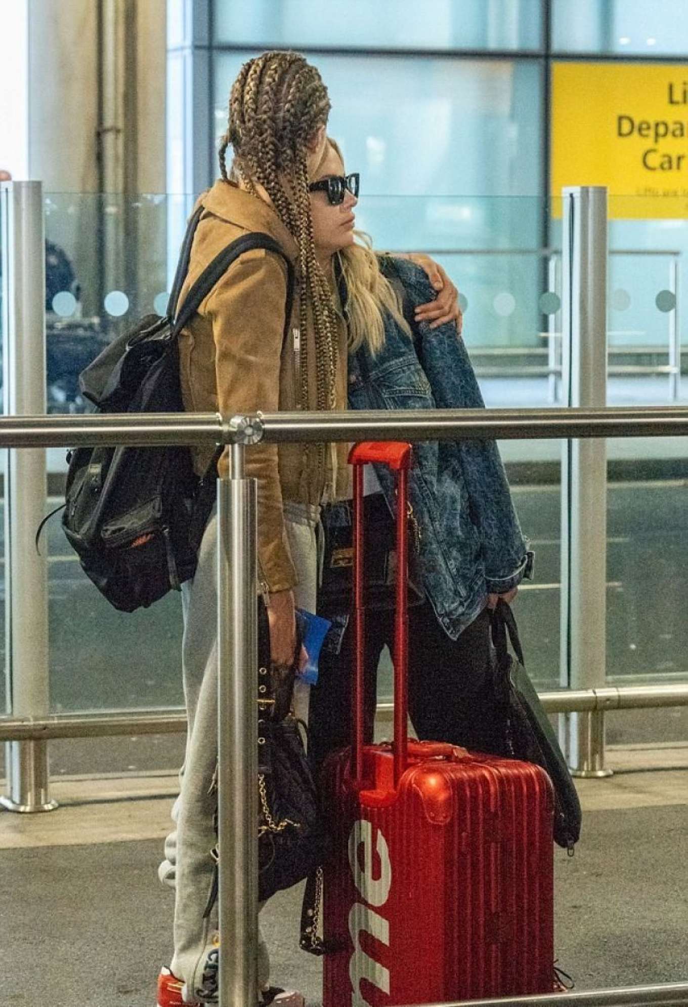 Ashley Benson and Cara Delevingne at Heathrow Airport in London