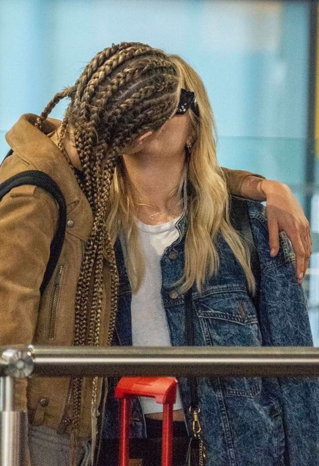 Ashley Benson and Cara Delevingne at Heathrow Airport in London