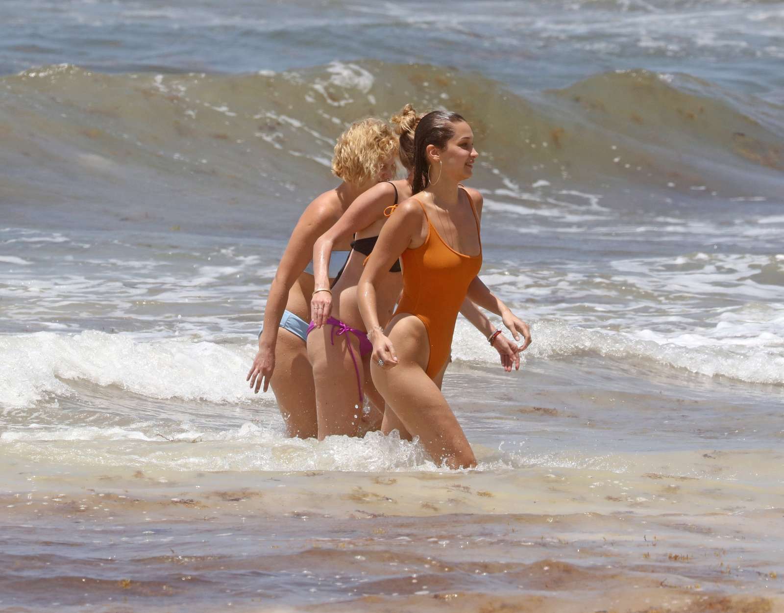 Bella Hadid in Orange Swimsuit on the beach in Cancun