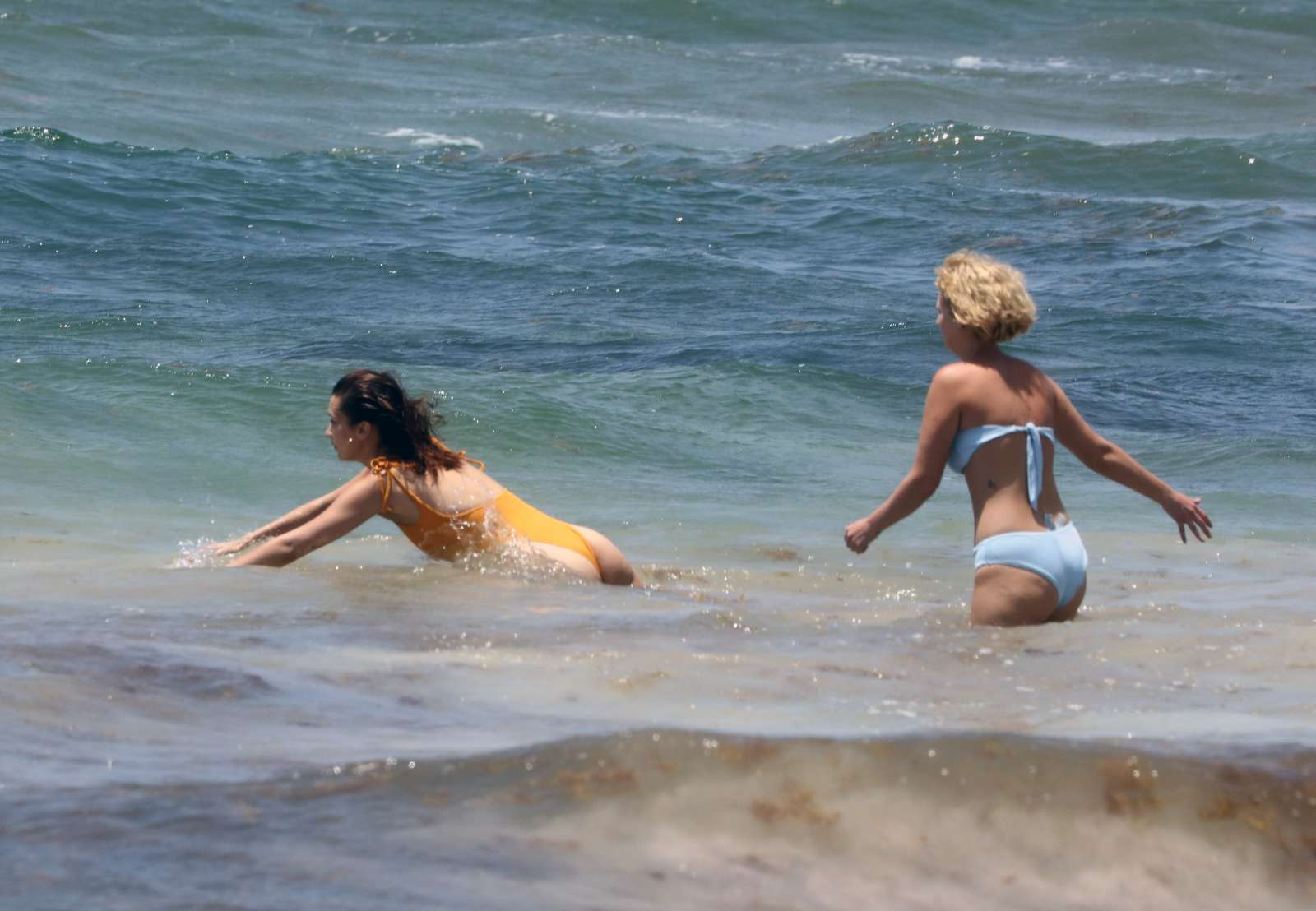 Bella Hadid in Orange Swimsuit on the beach in Cancun