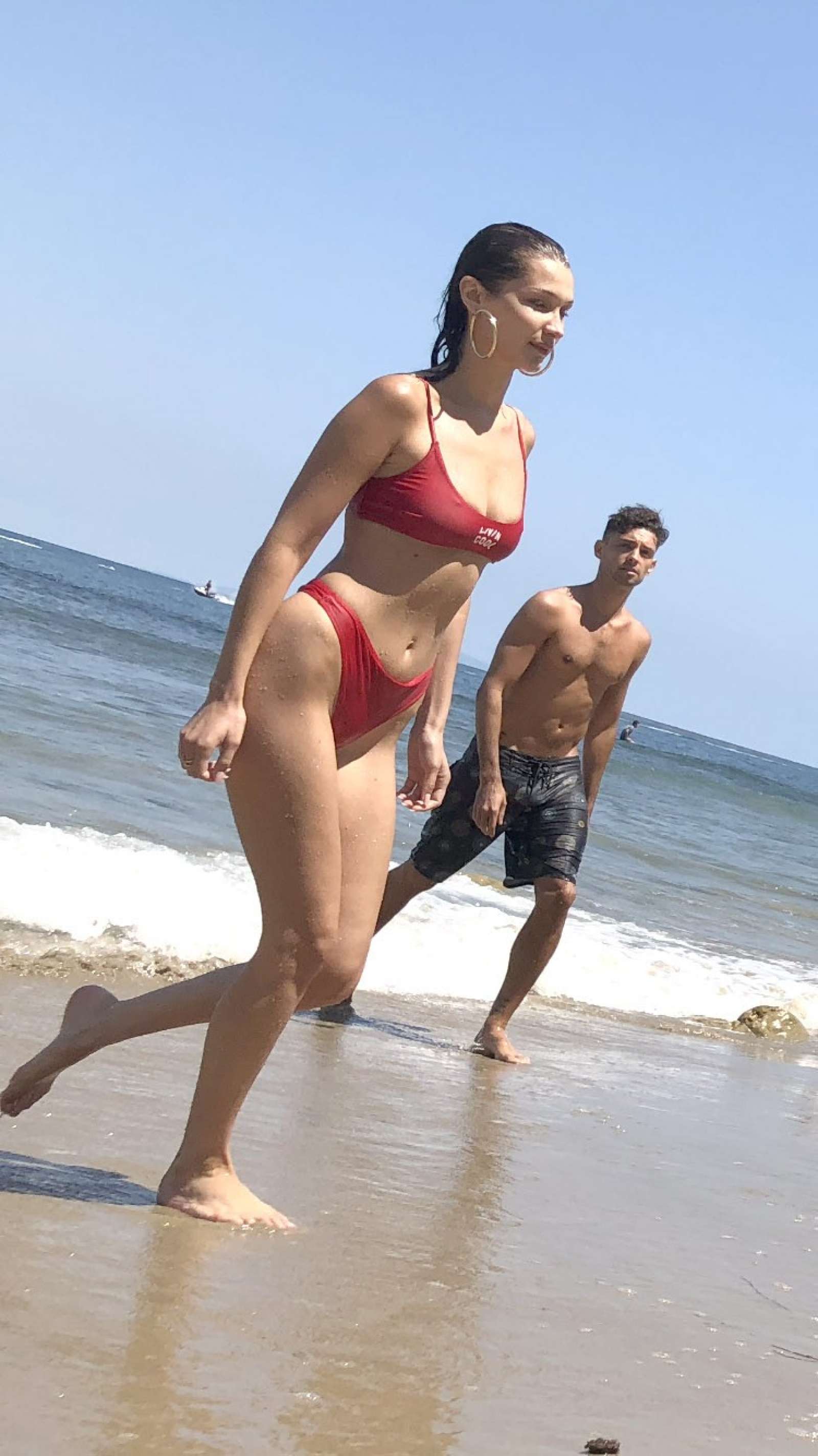 Bella Hadid in Red Bikini on the beach in Malibu