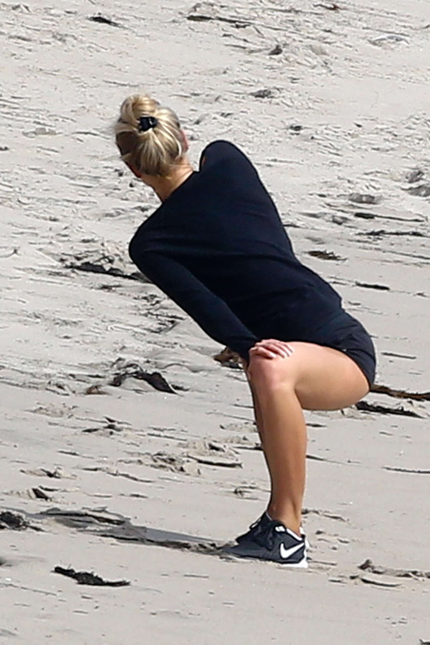 Charlotte McKinney in Shorts works out on Malibu Beach
