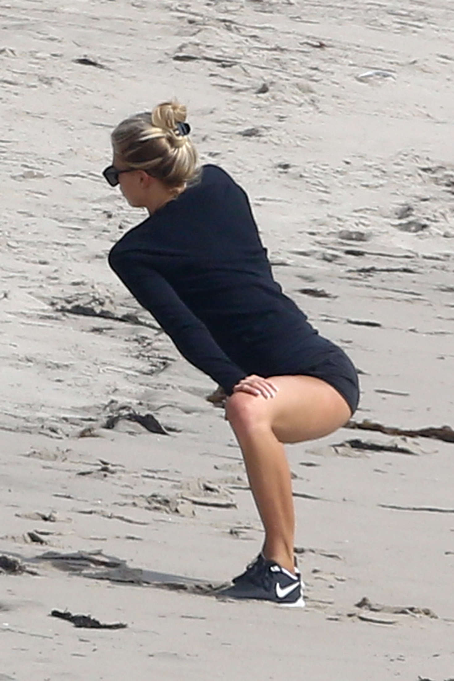 Charlotte McKinney in Shorts works out on Malibu Beach