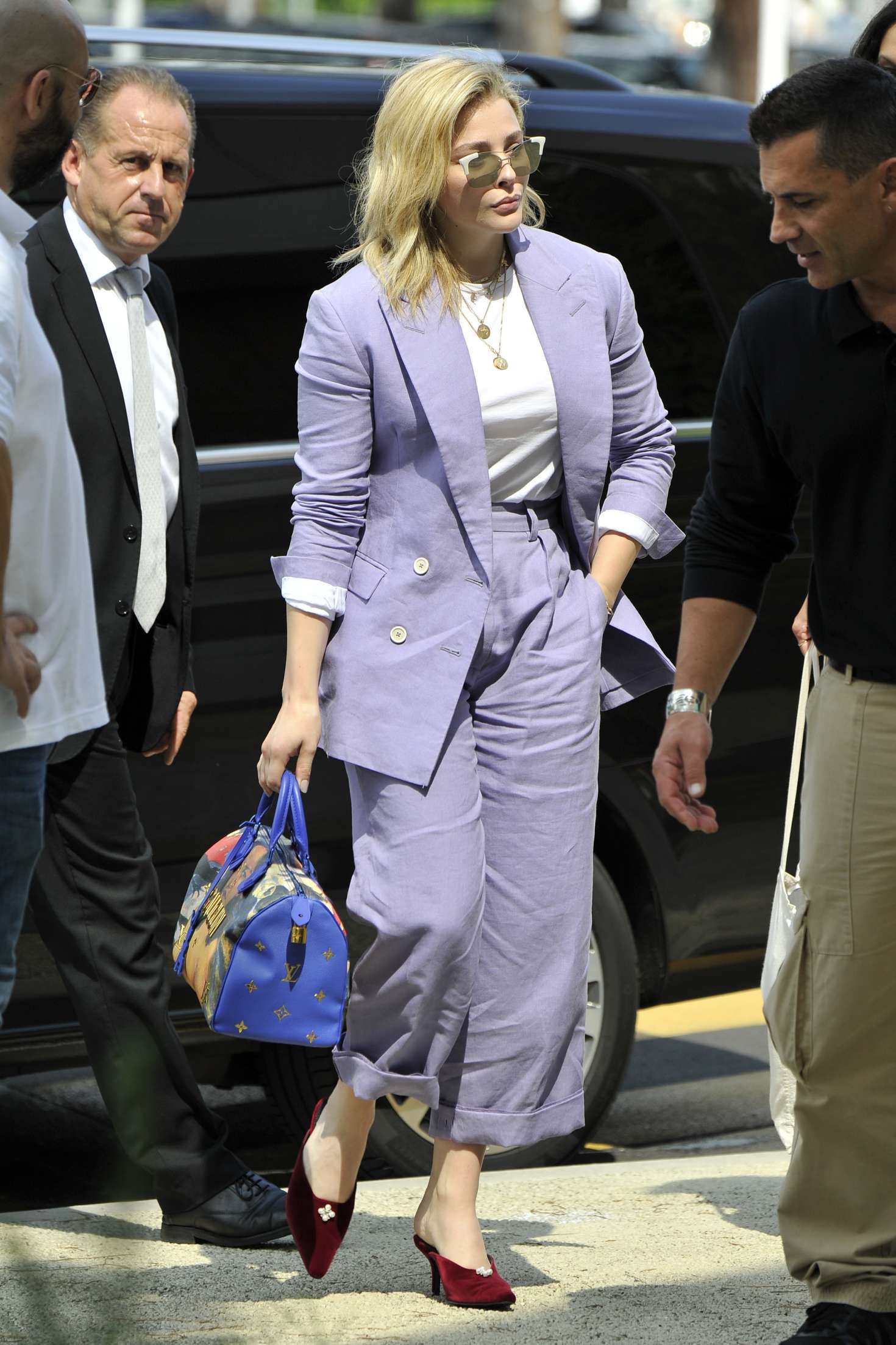 Chloe Moretz in Purple Suit â€“ Arrives in Venice