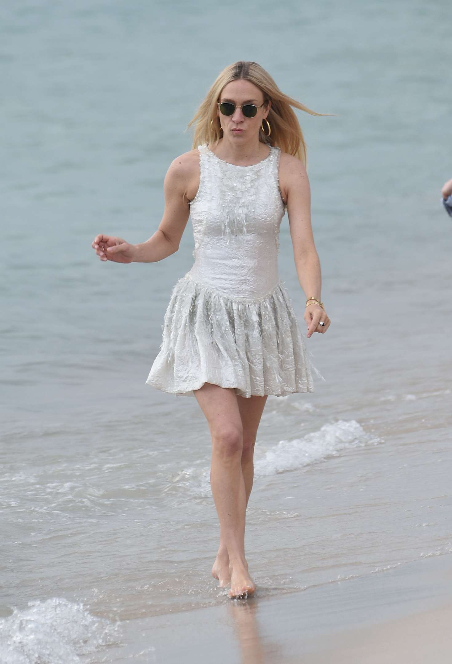 Chloe Sevigny in White Mini Dress on the beach in Cannes