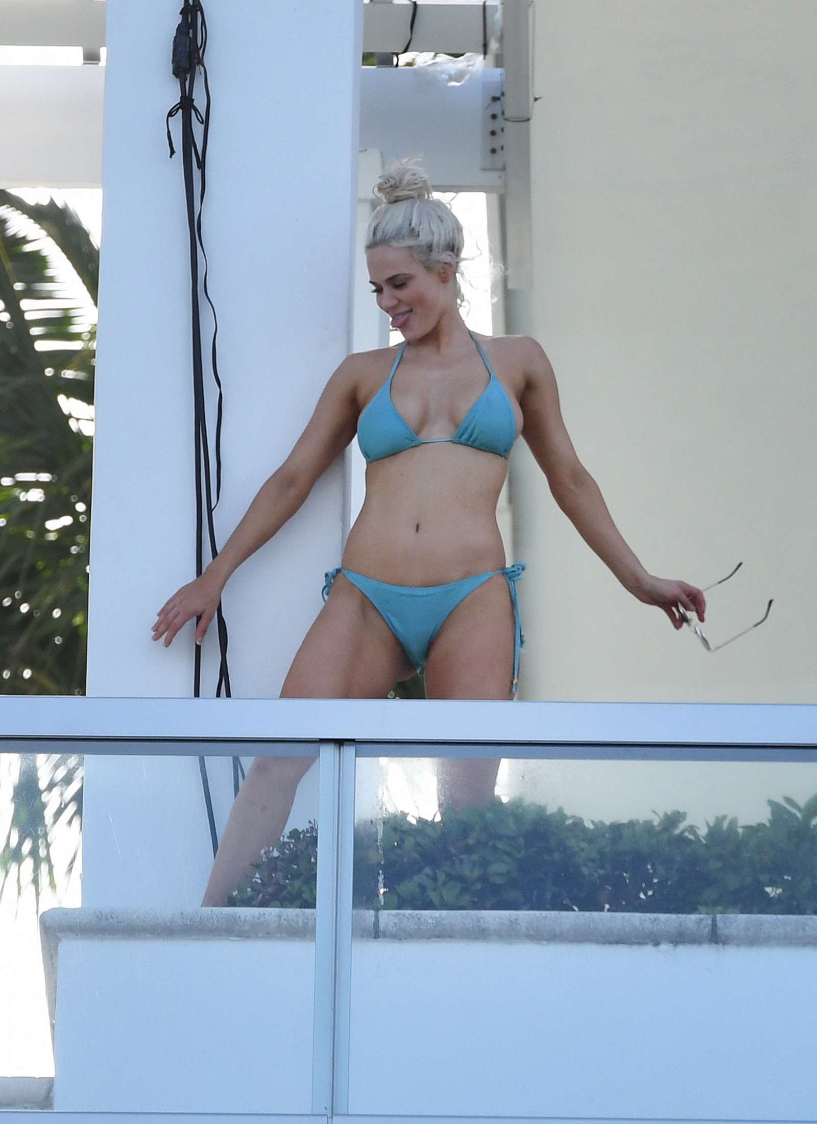 CJ Perry Lana in Blue Bikini on a balcony in Miami