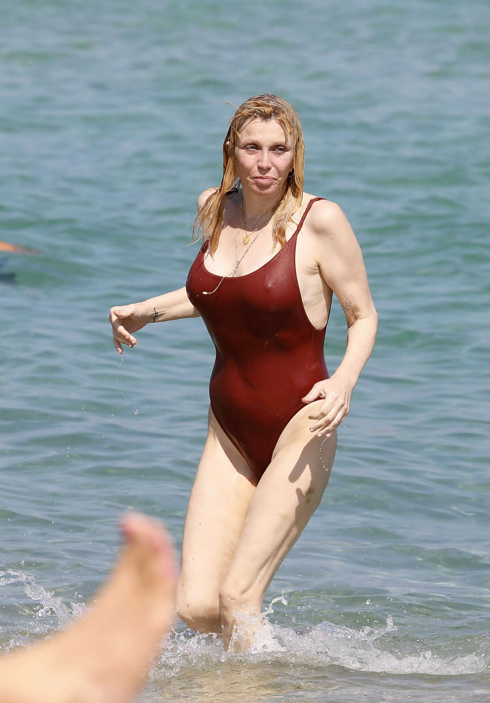 Courtney Love in Red Swimsuit in Saint Tropez