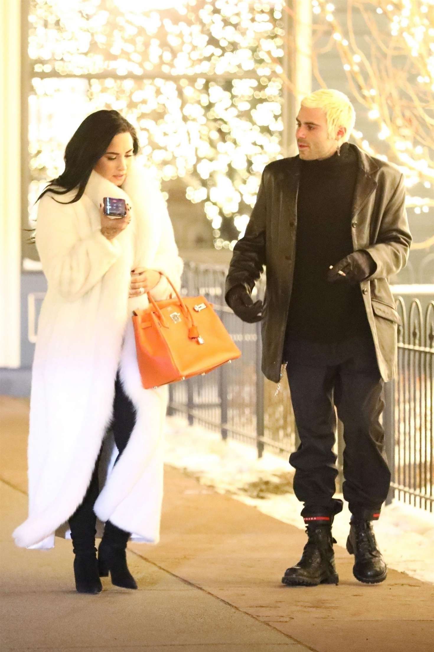 Demi Lovato in White Fur Coat with Henri Levy â€“ Out in Aspen