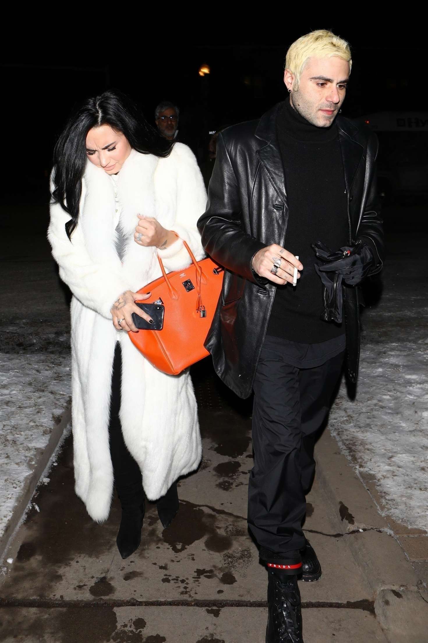 Demi Lovato in White Fur Coat with Henri Levy â€“ Out in Aspen