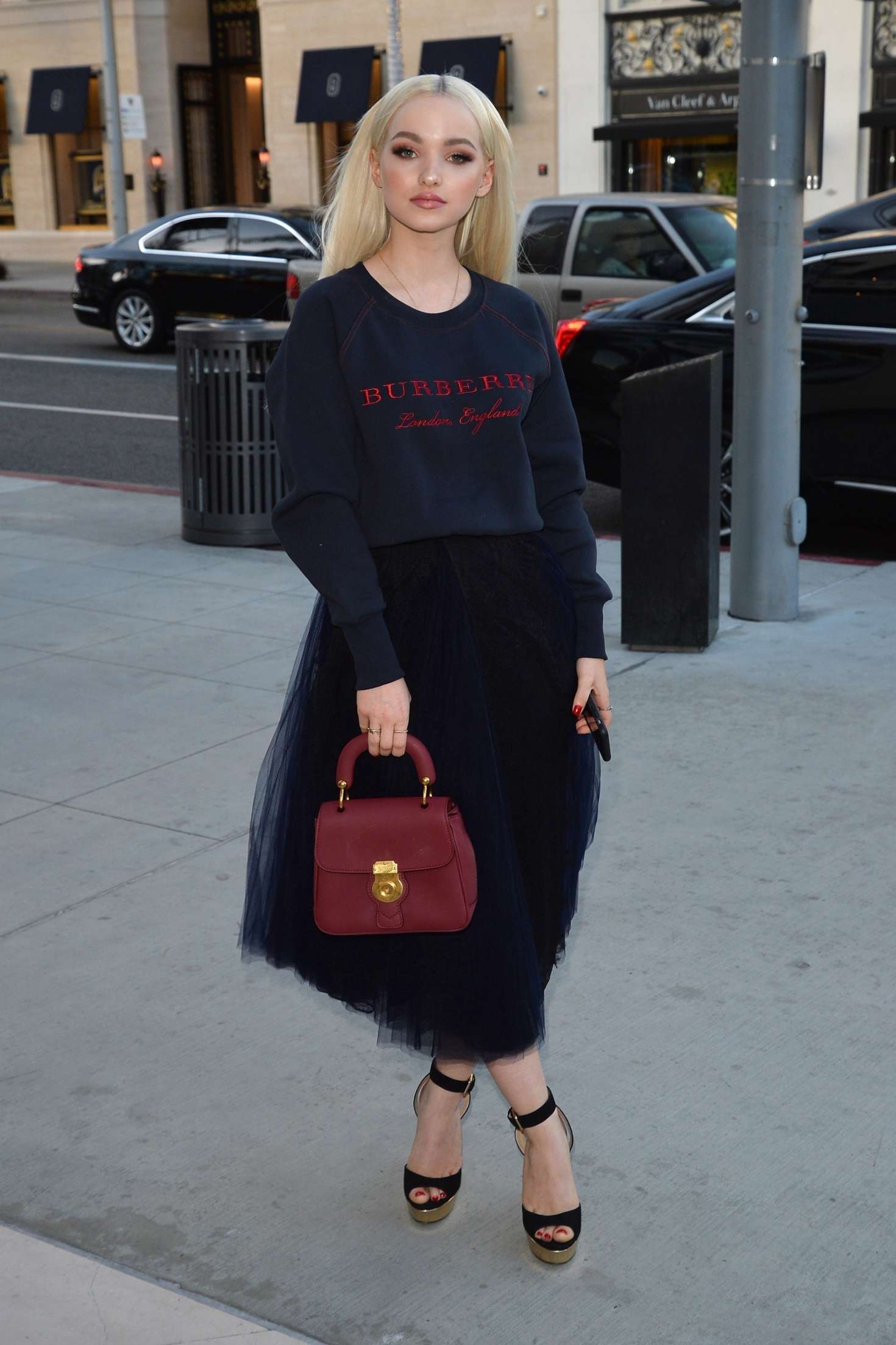 Dove Cameron â€“ Arrives at a party at the Rodeo Drive Burberry store in Beverly Hills