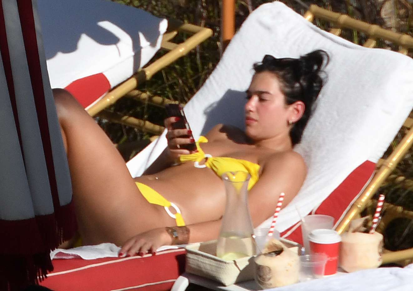 Dua Lipa â€“ Wearing yellow bikini in Miami