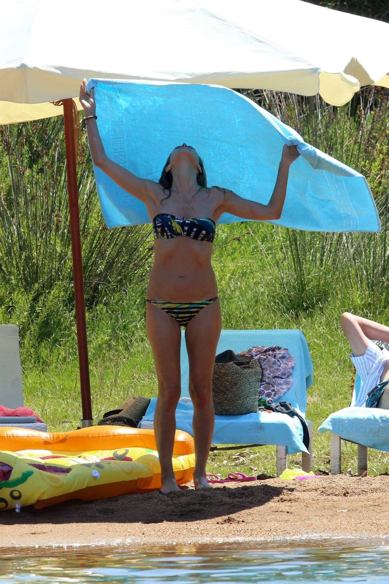 Heidi Klum in Bikini at the beach in Corsica