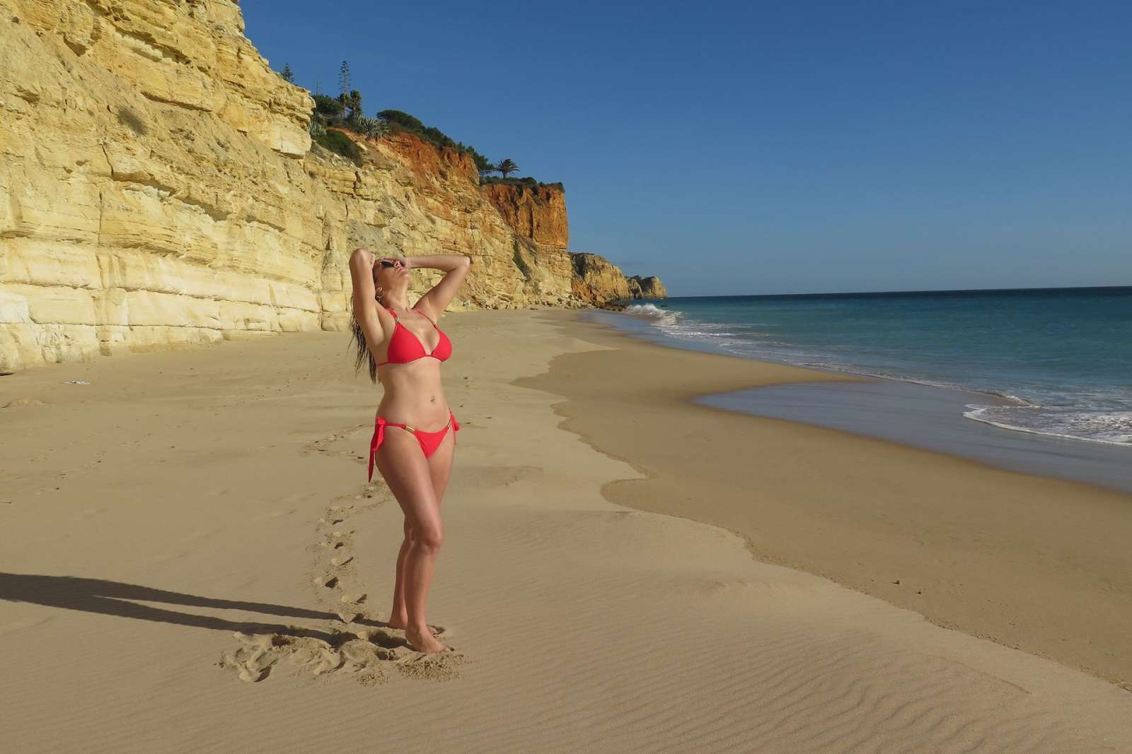 Imogen Thomas in Red Bikini on a beach in Portugal