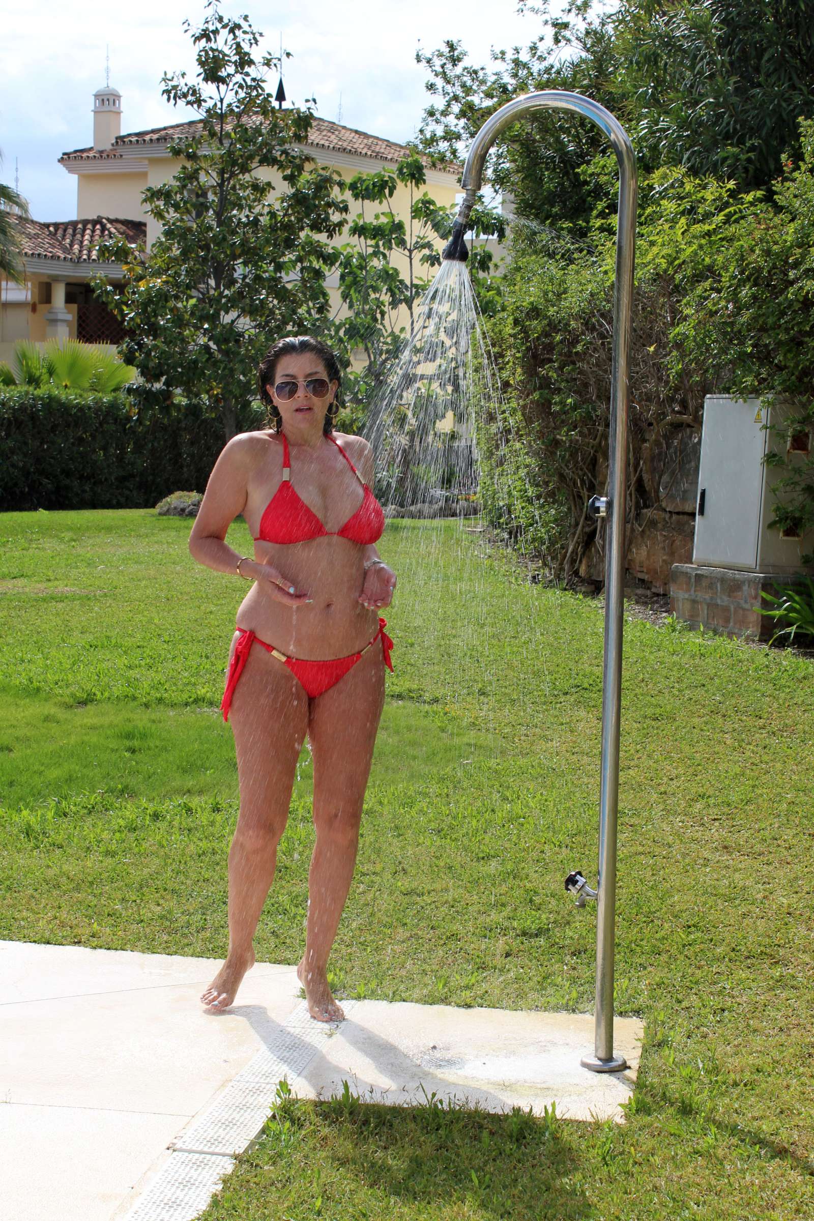 Imogen Thomas in Red Bikini on the pool in Marbella