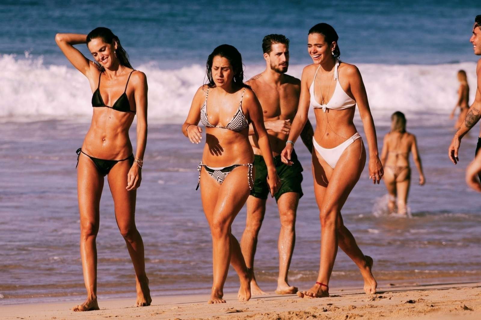 Izabel Goulart in Black Bikini at the beach in Brazil