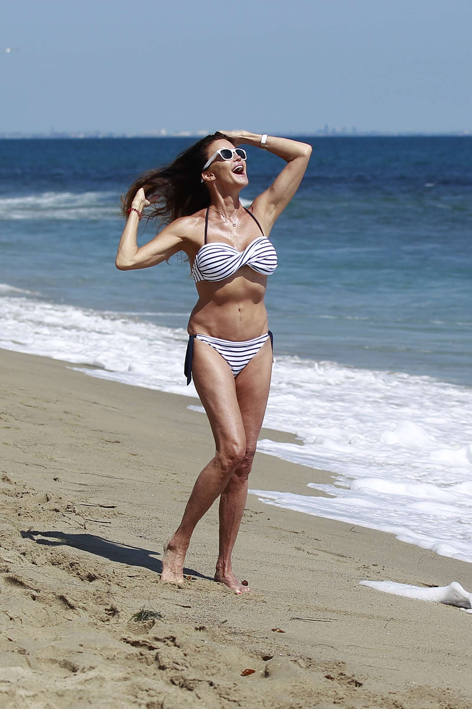 Janice Dickinson in Bikini on the beach in Malibu