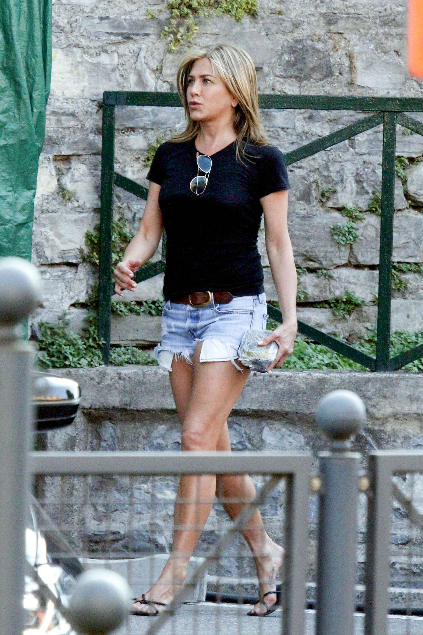 Jennifer Aniston in Jeans Shorts â€“ Leaving the set of â€˜Murder Mysteryâ€™ in Lake Como