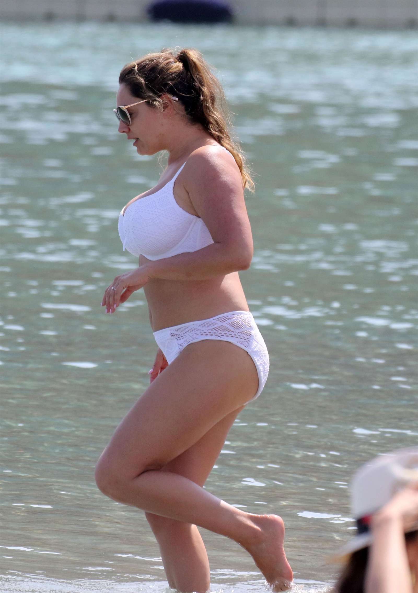 Kelly Brook in White Bikini on the beach in Mykonos