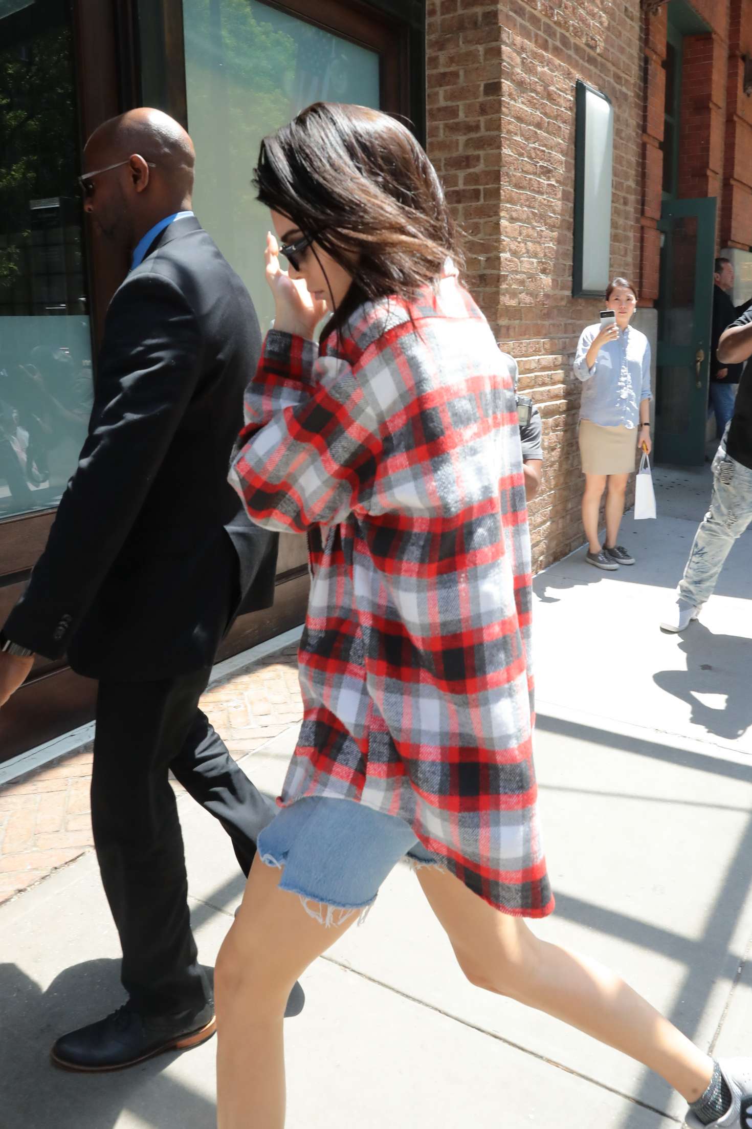 Kendall Jenner â€“ Wearing a Plaid Oversized Shirt and Denim Shorts out in Tribeca