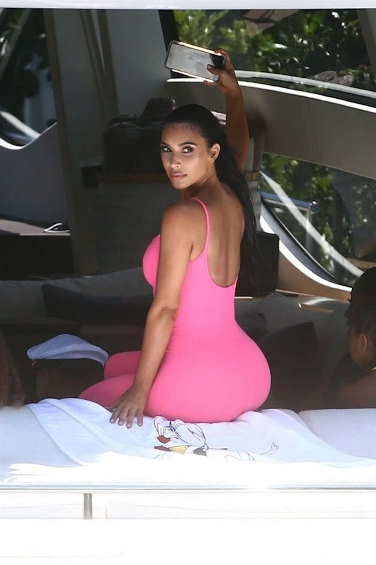 Kim Kardashian in Pink Tights on a boat in Miami