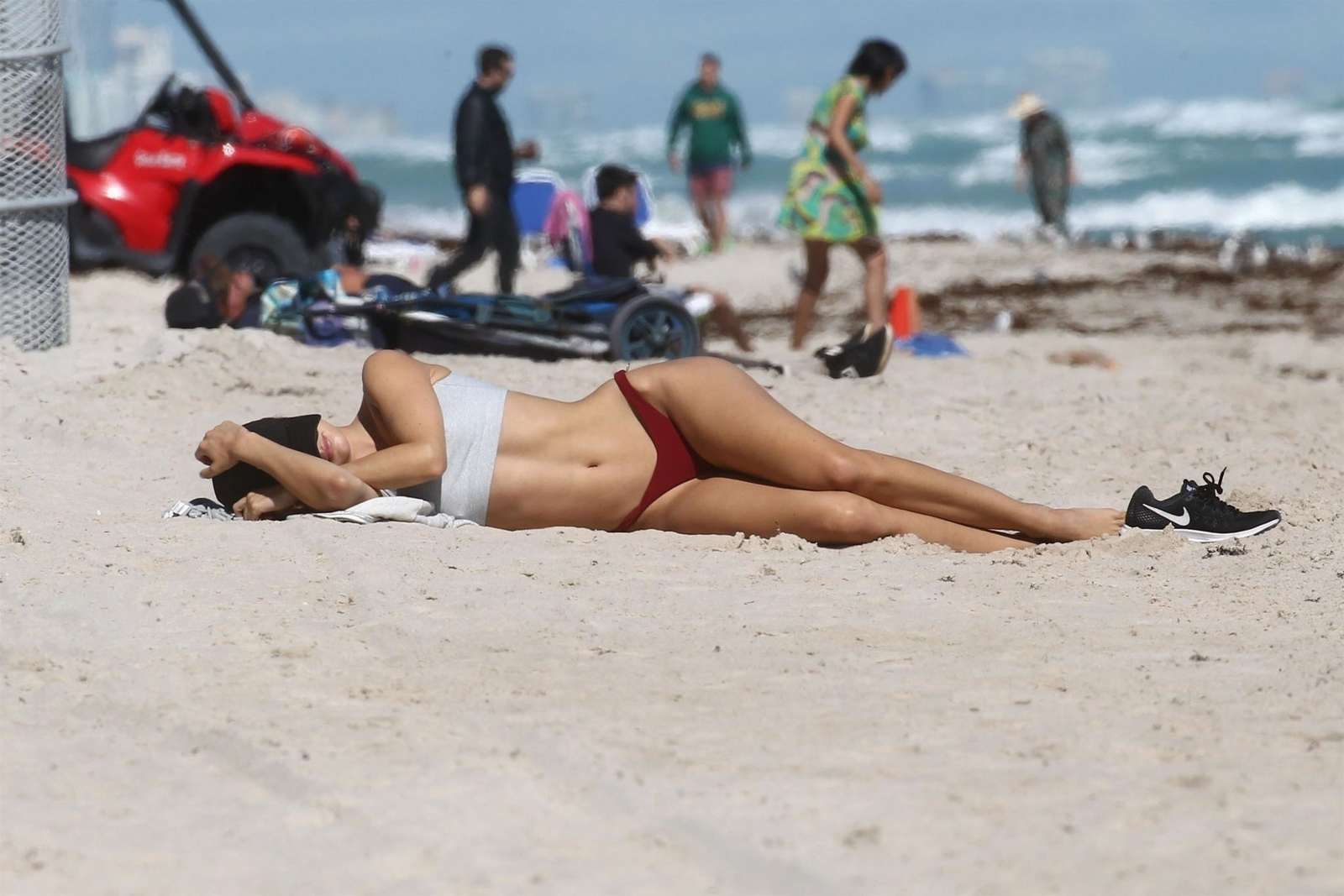Kimberley Garner in Red Bikini and Sports Bra at the beach in Miami