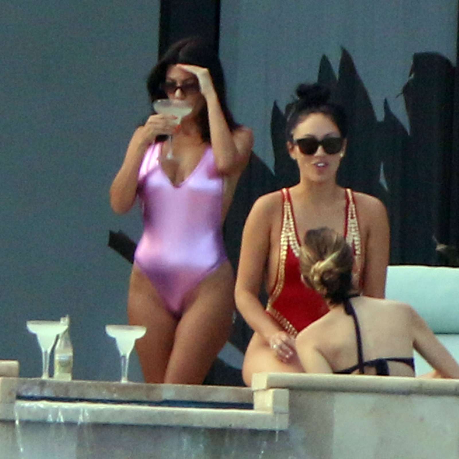 Kourtney Kardashian in Pink Swimsuit on the pool in Cabo