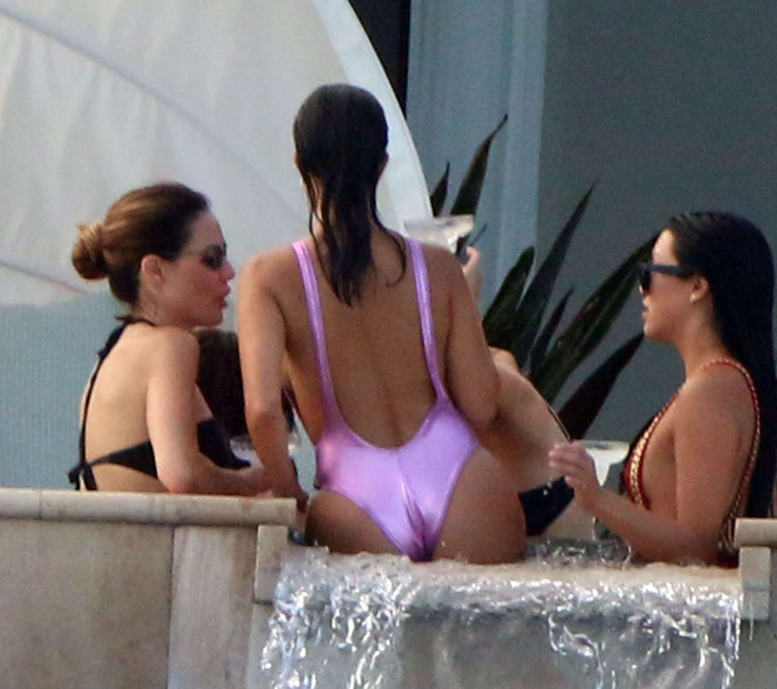 Kourtney Kardashian in Pink Swimsuit on the pool in Cabo