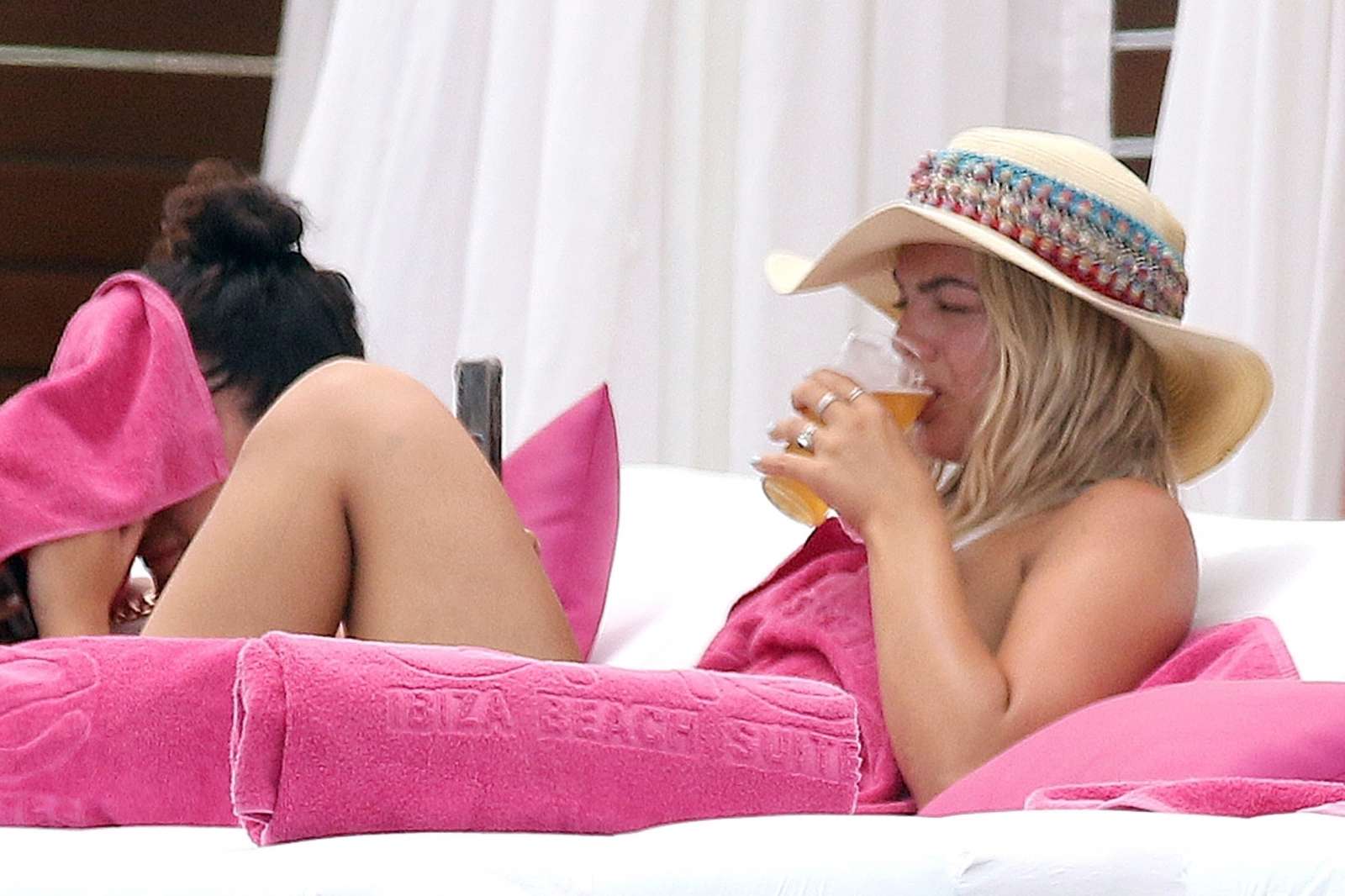 Louisa Johnson â€“ Bikini by the pool with a friend in Ibiza
