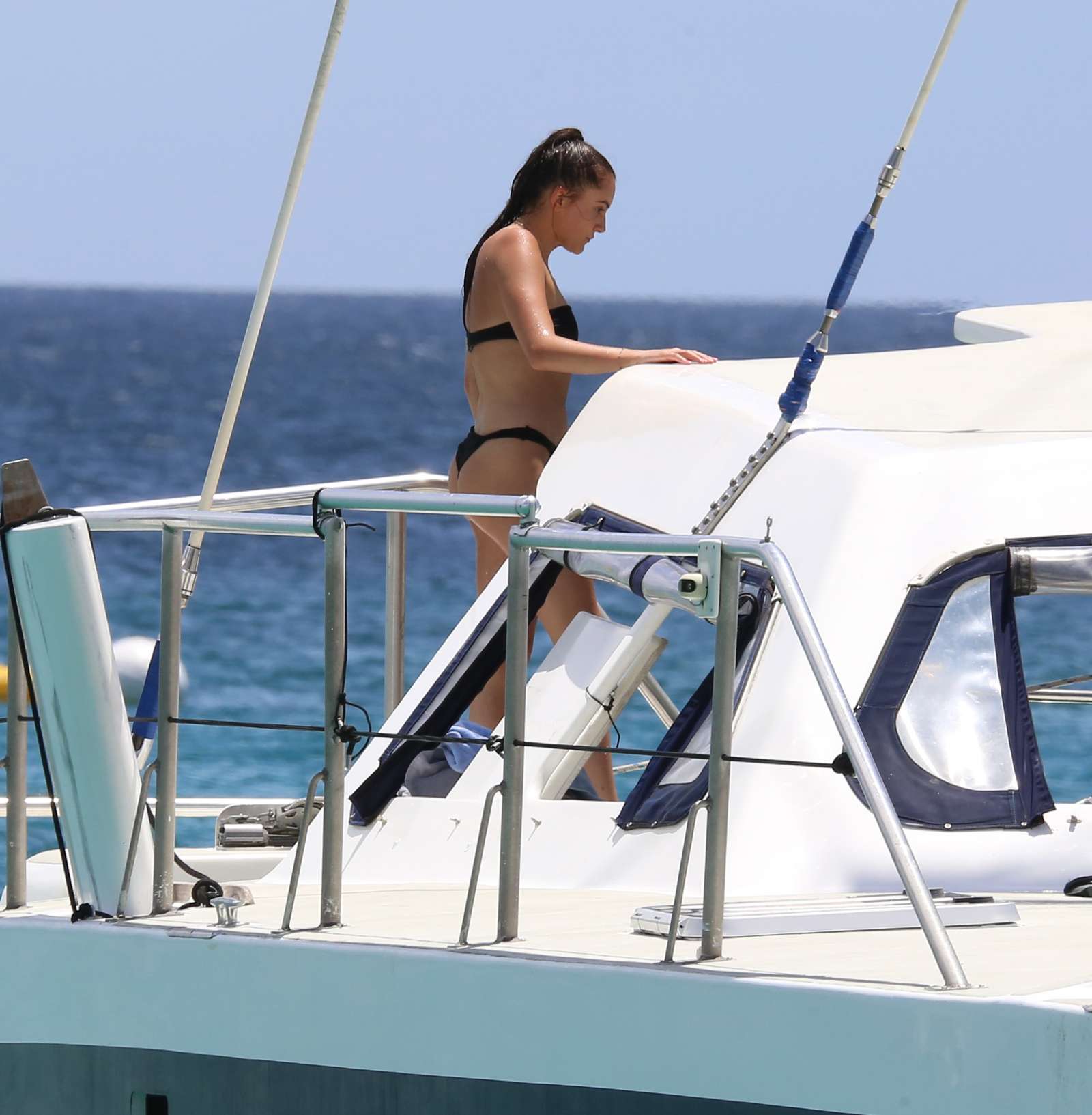 Lucia Loi in Black Bikini on the yacht in Barbados