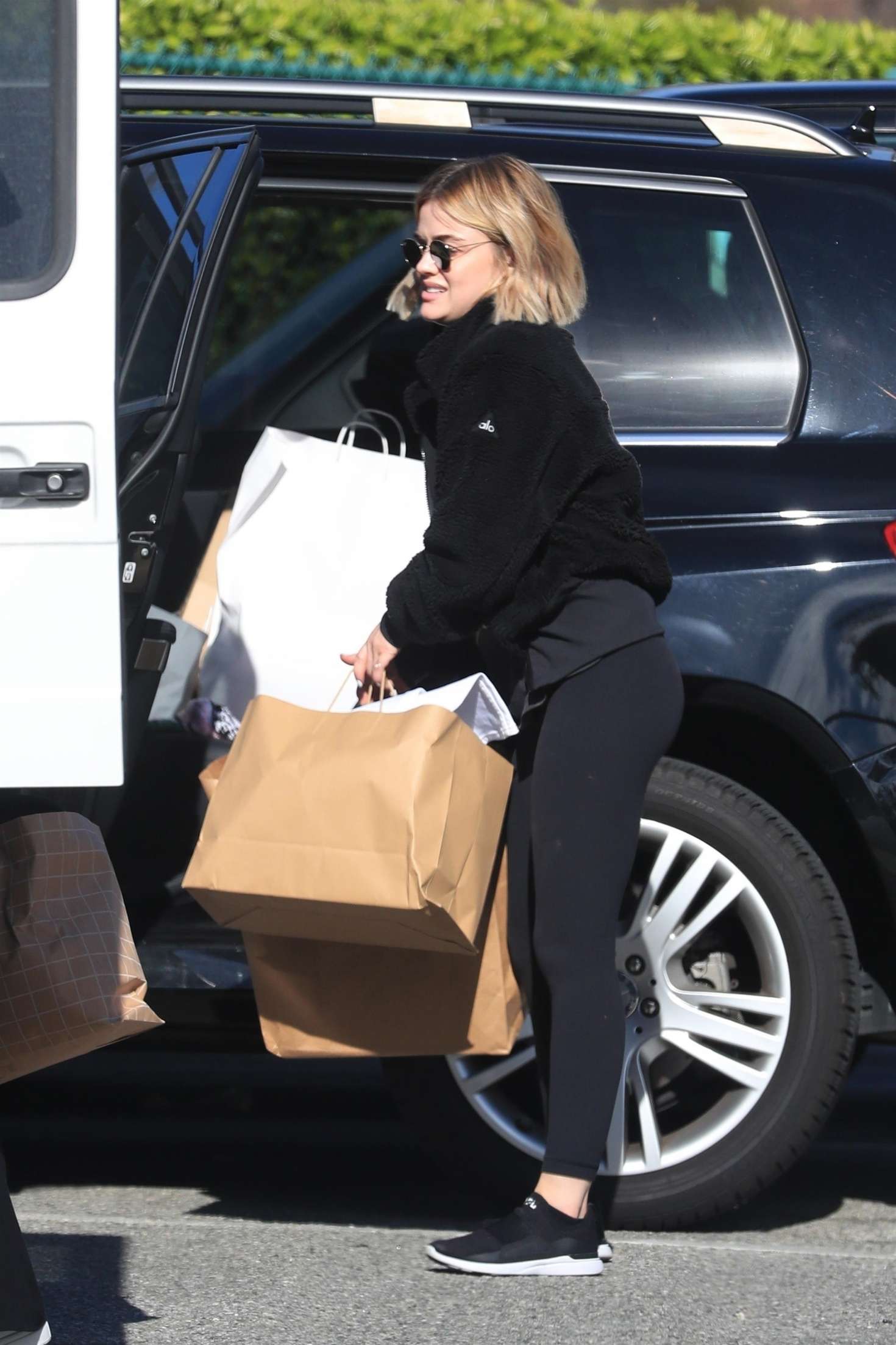 Lucy Hale â€“ Handling a large package in Beverly Hills