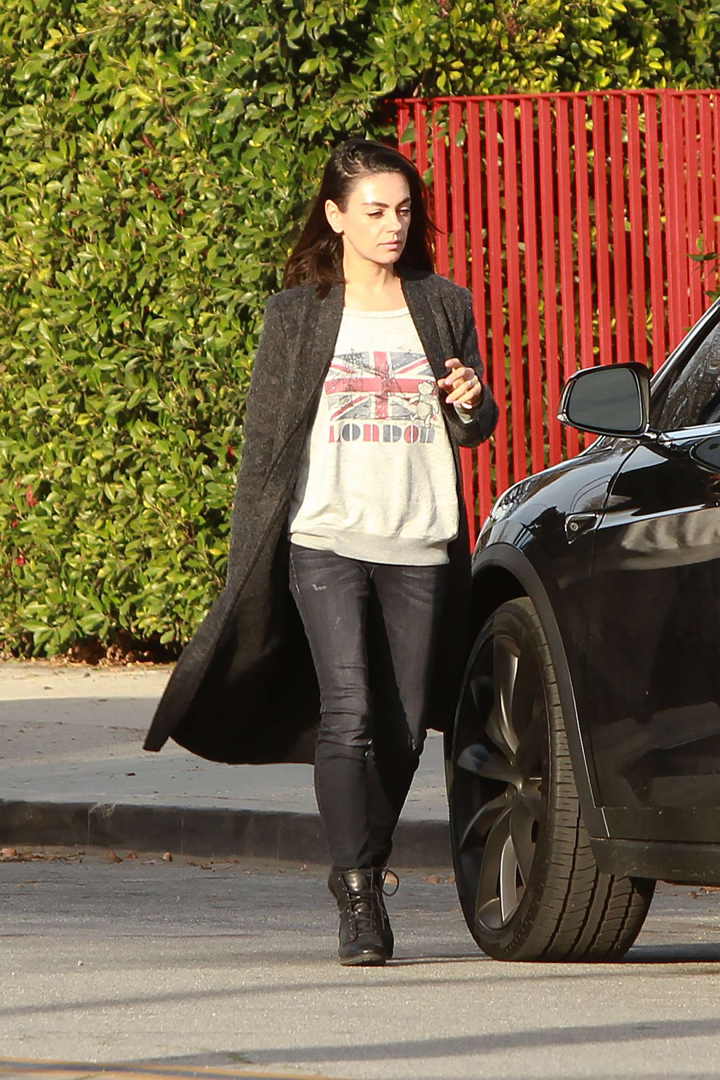 Mila Kunis â€“ Wearing a Mickey Mouse sweater in Los Angeles
