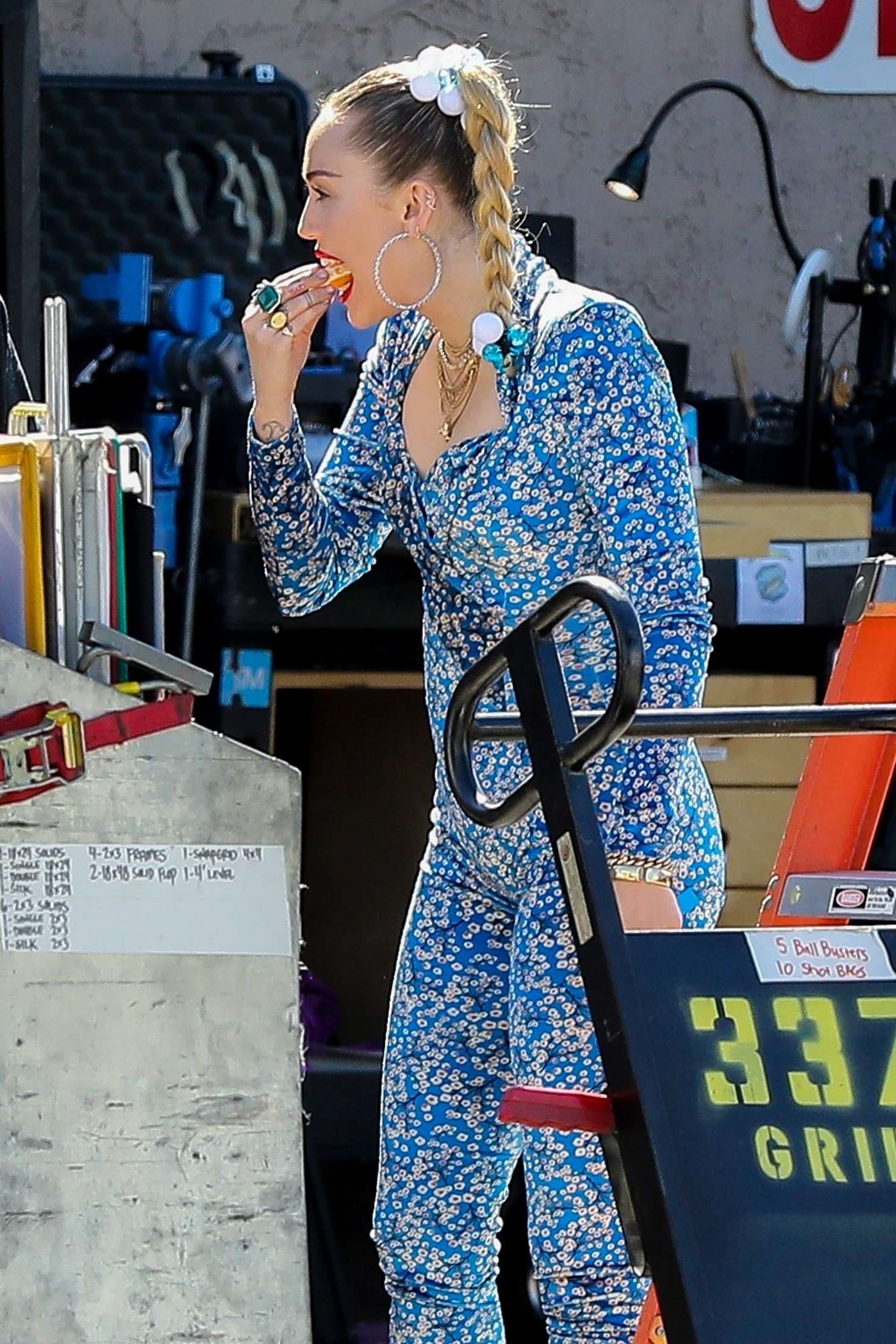 Miley Cyrus in Blue Floral Jumpsuit â€“ On set of her latest project in Los Angeles