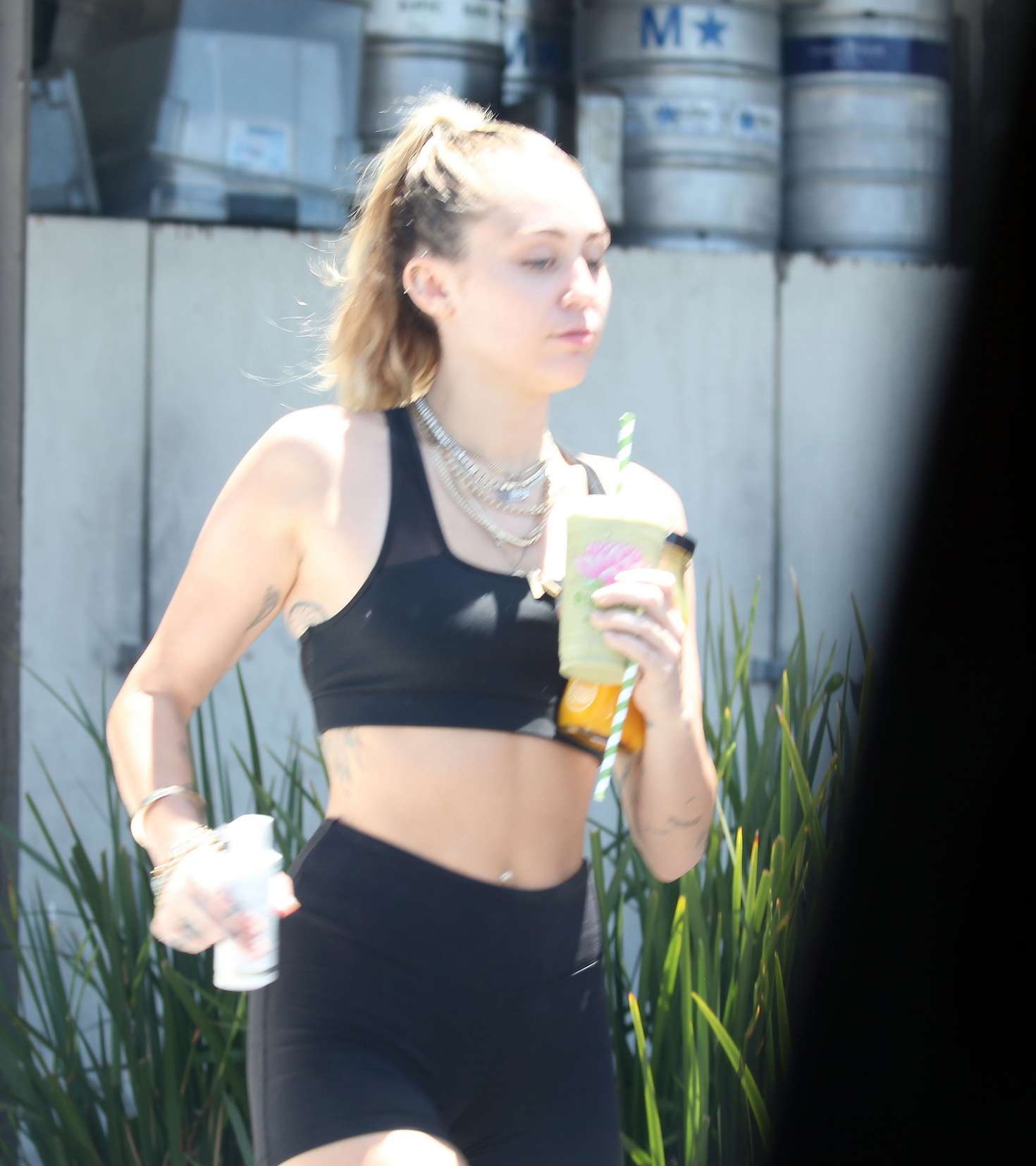 Miley Cyrus in Shorts and Sports Bra out in Malibu