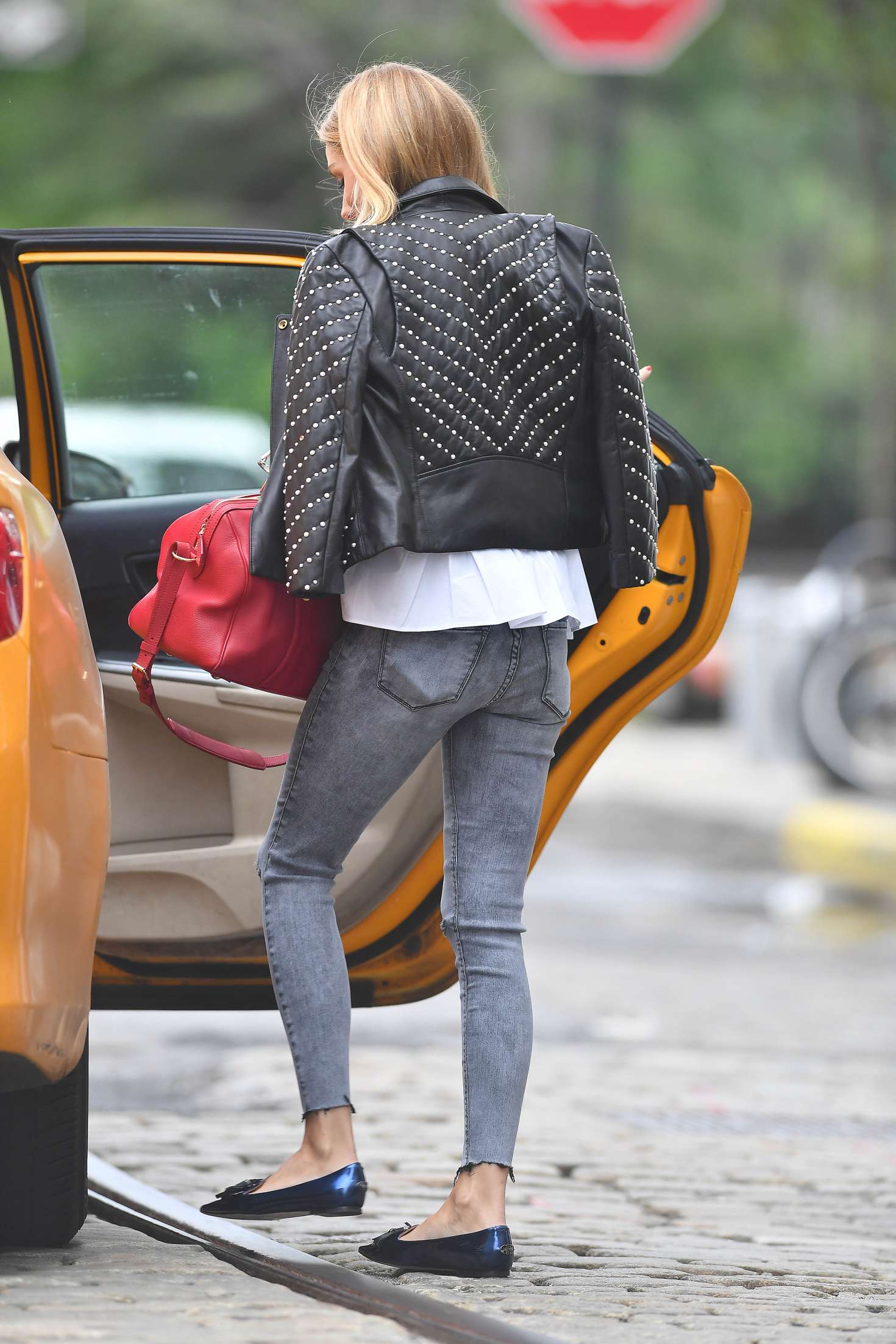 Olivia Palermo hailing a cab in New York