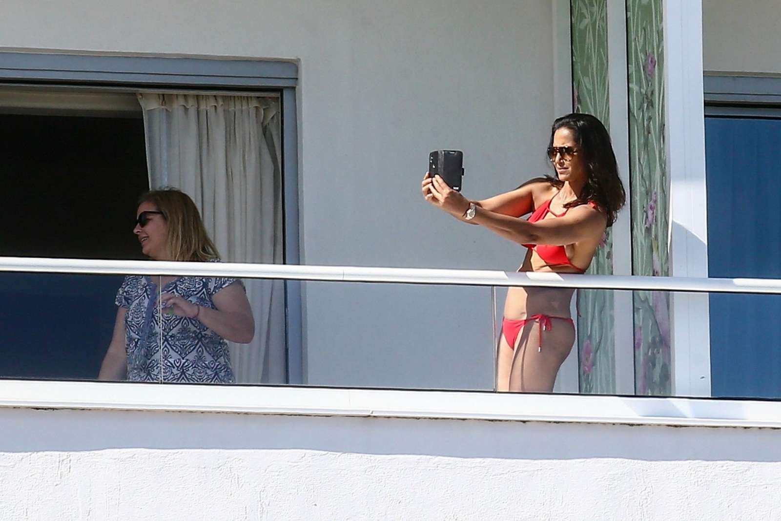 Padma Lakshmi in Red Bikini on her hotel balcony in Miami