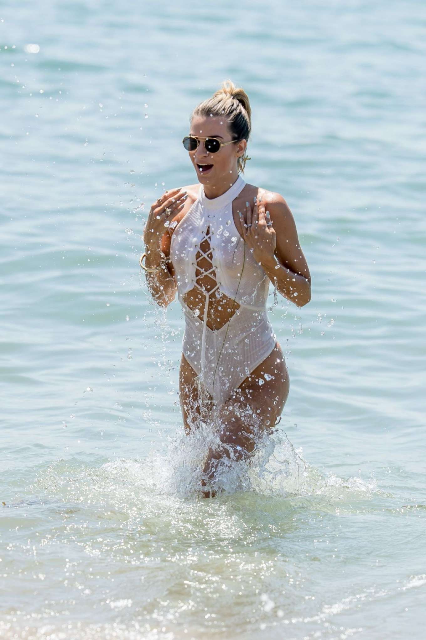 Rachel McCord in White Swimsuit at the beach in Malibu