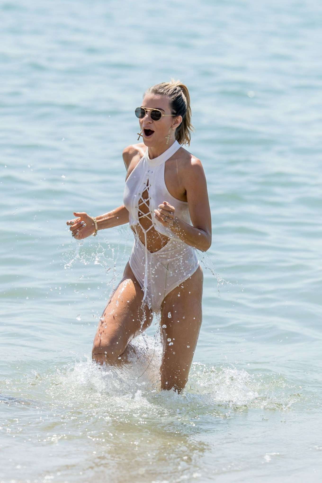 Rachel McCord in White Swimsuit at the beach in Malibu