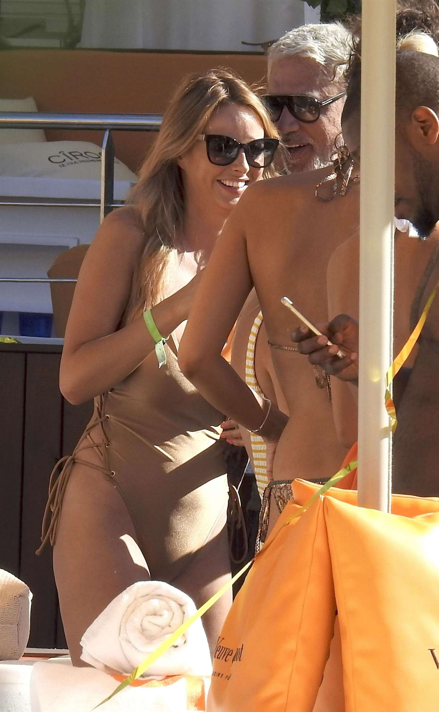 Rhian Sugden â€“ In gold tight swimsuit at Ibizas Ocean Beach Club
