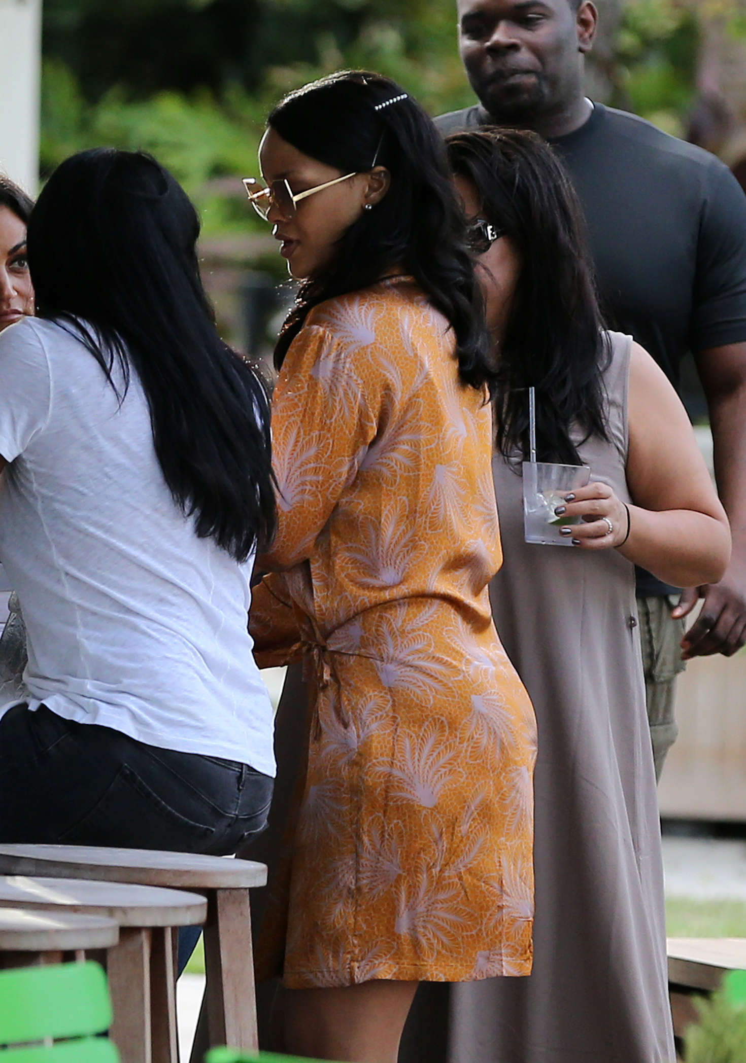 Rihanna in Mini Dress at a poolside bar in Miami