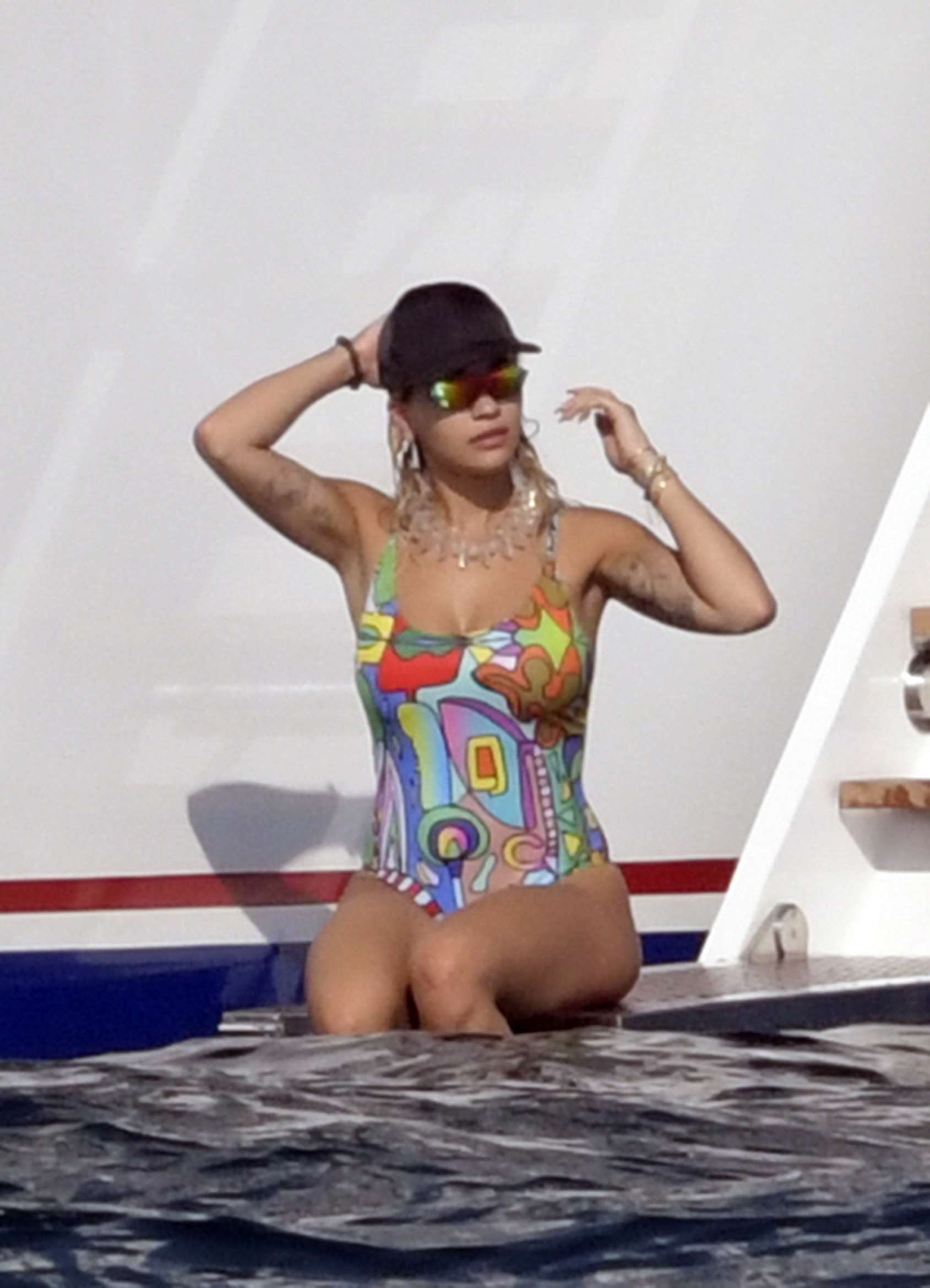 Rita Ora in Colourful Swimsuit on holiday in Porto Cervo