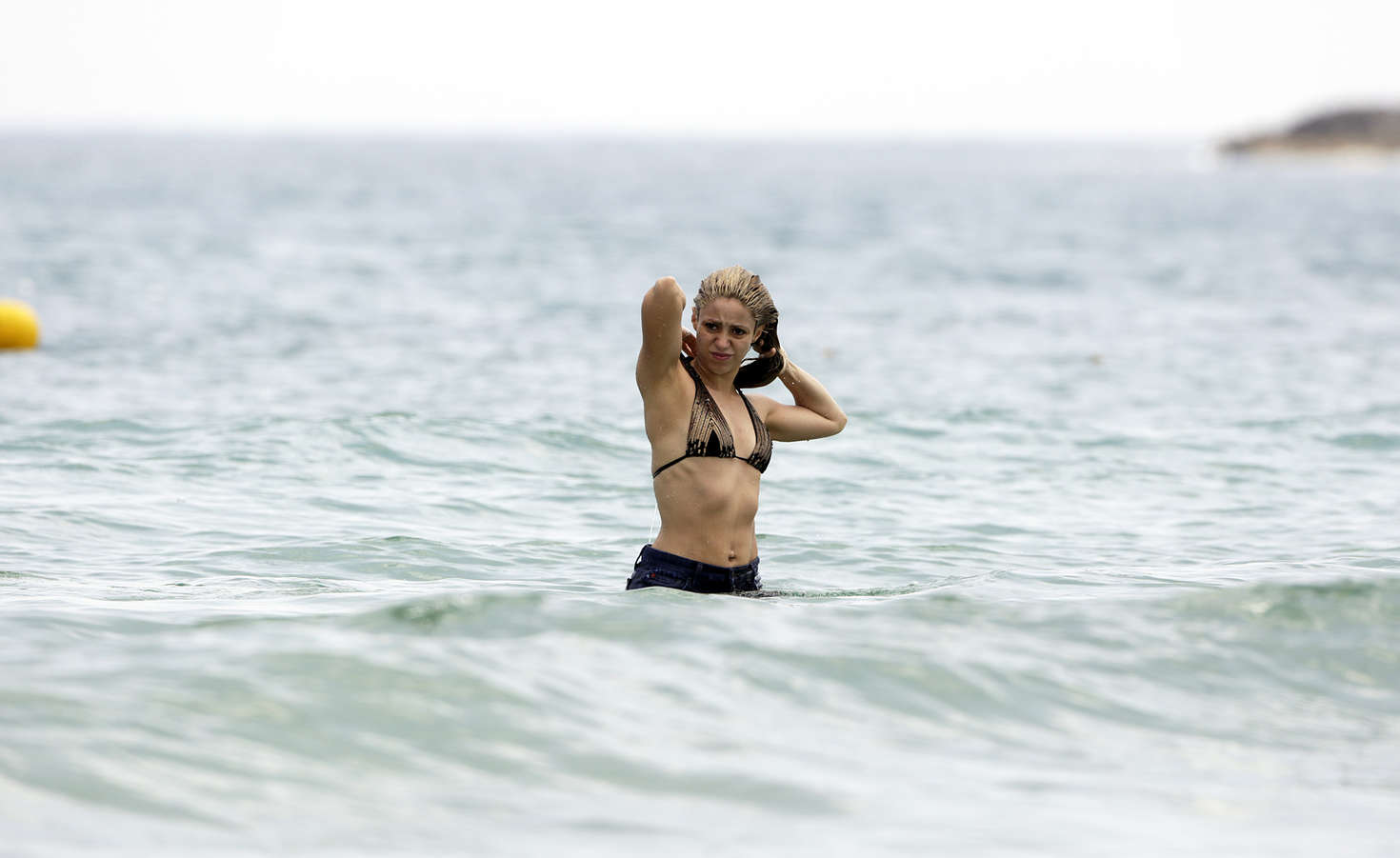Shakira in Bikini Top at the Beach in Ibiza