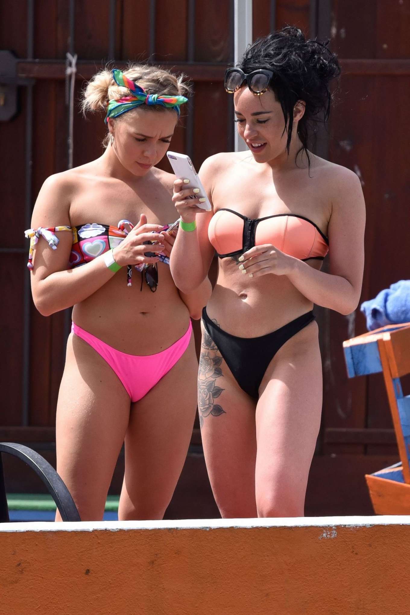 Stephanie Davis and Gabby Allen in Bikini on the pool in Marbella