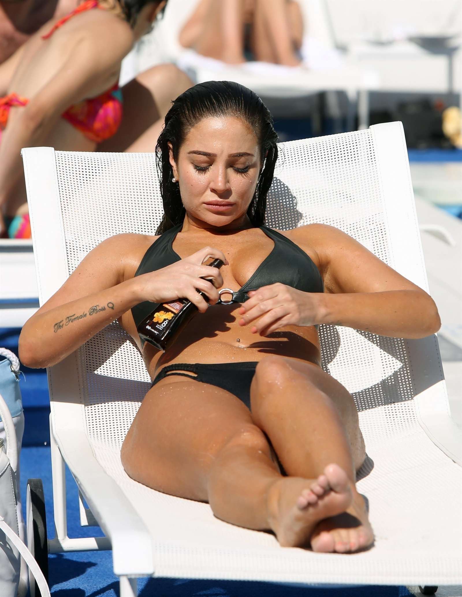 Tulisa Contostavlos in Black Bikini on the pool in Los Angeles