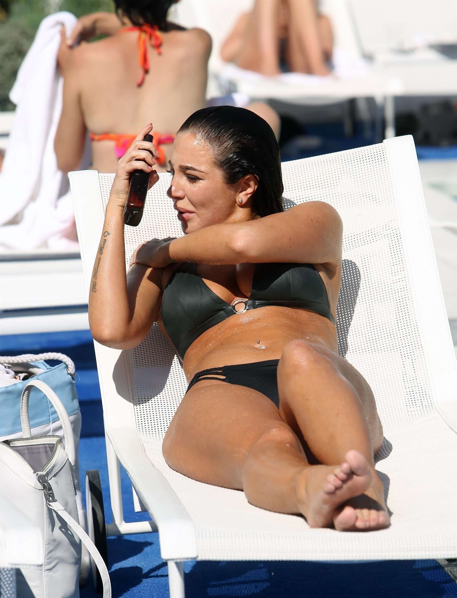 Tulisa Contostavlos in Black Bikini on the pool in Los Angeles