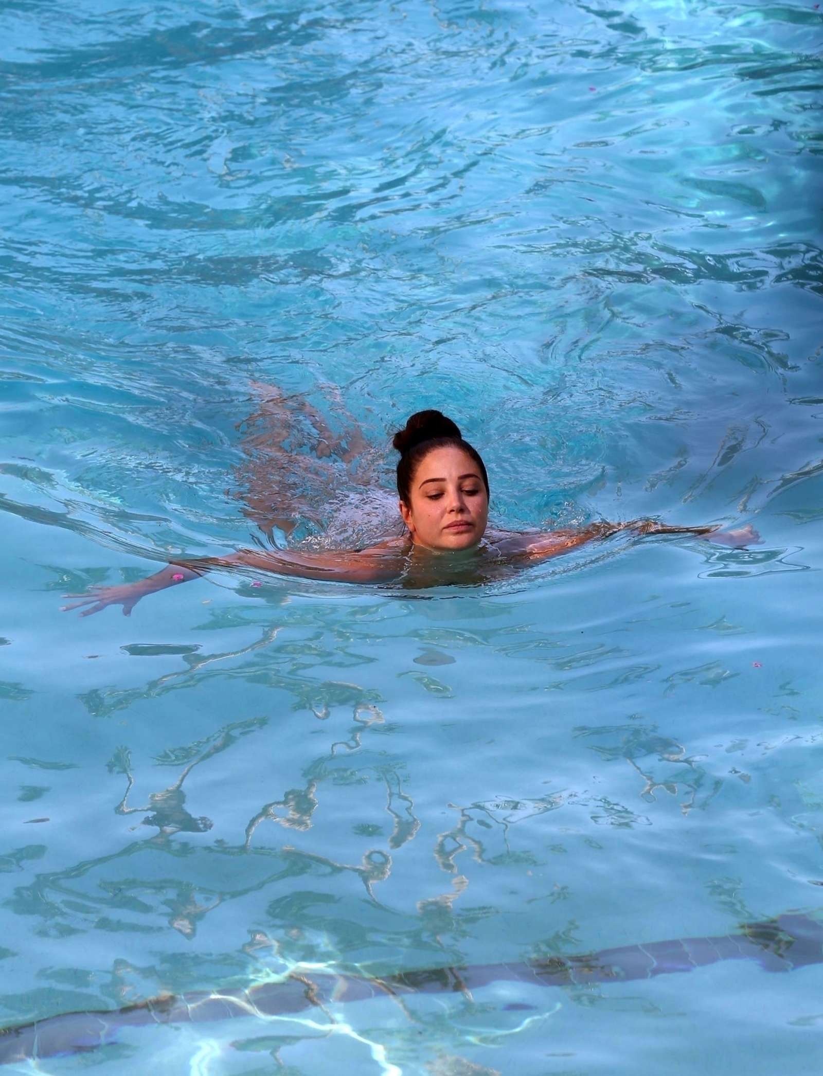 Tulisa Contostavlos in White Bikini on the pool in Los Angeles