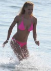 Michelle Hunziker - Big Cleavage in pink Bikini on the beach in Varigotti, Italy